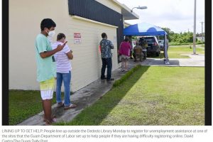 LINING UP TO GET HELP: People line up outside the Dededo Library Monday to register for unemployment assistance at one of the sites that the Guam Department of Labor set up to help people if they are having difficulty registering online. David Castro/The Guam Daily Post
