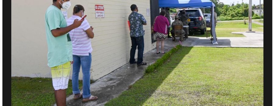 LINING UP TO GET HELP: People line up outside the Dededo Library Monday to register for unemployment assistance at one of the sites that the Guam Department of Labor set up to help people if they are having difficulty registering online. David Castro/The Guam Daily Post